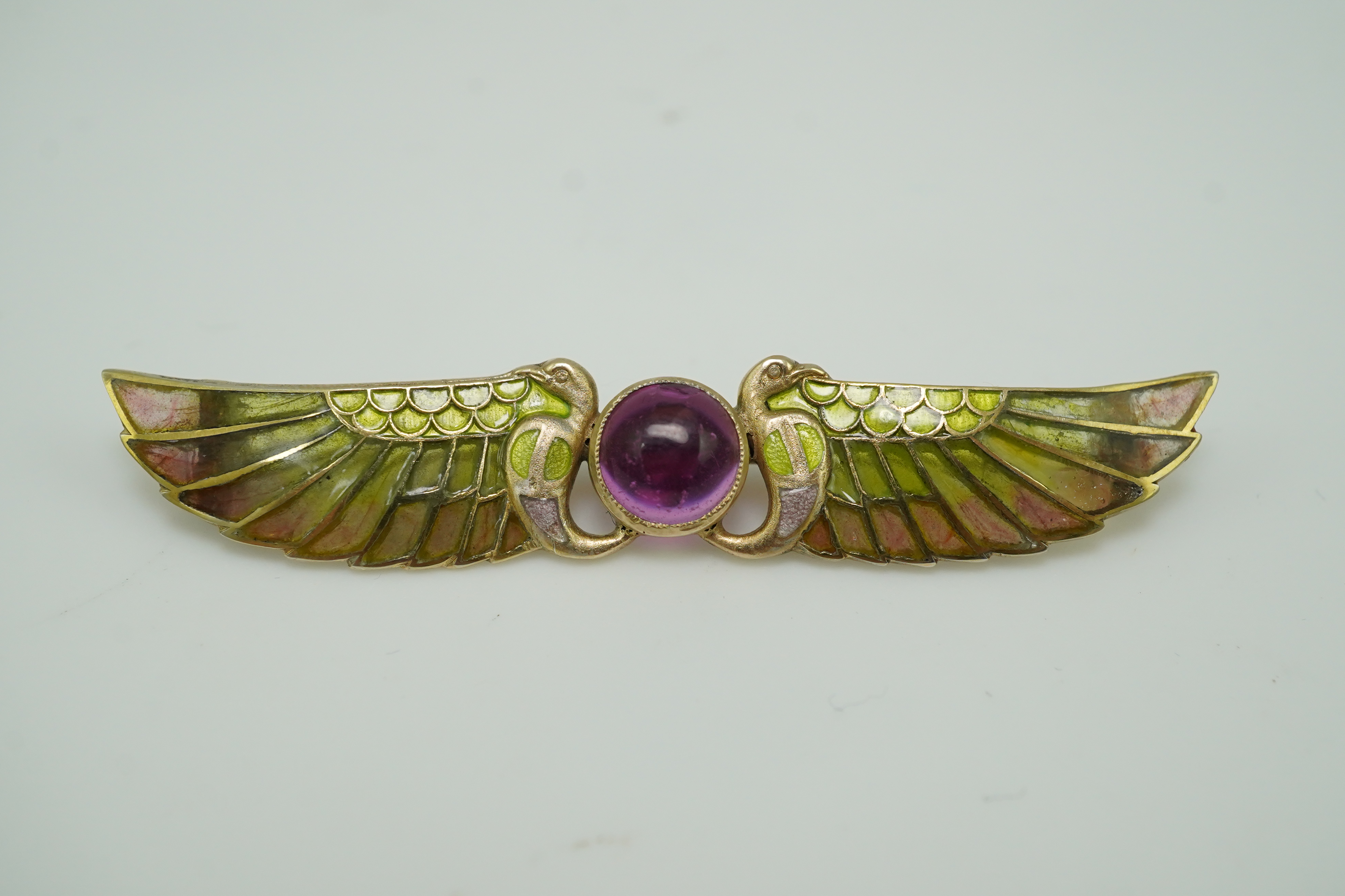 An Egyptian Revival tourmaline and enamel brooch, circa 1900